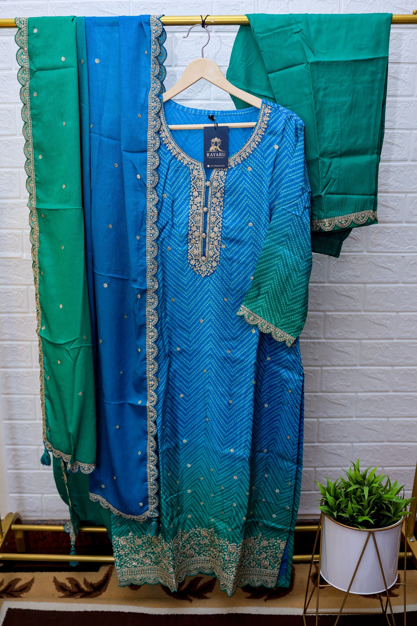 A stunning teal blue silk Kurti adorned with intricate golden threadwork