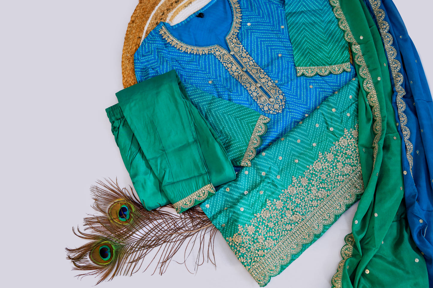A stunning teal blue silk Kurti adorned with intricate golden threadwork