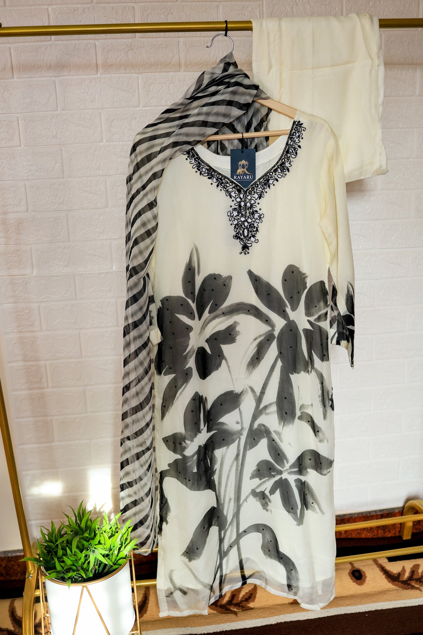 Elegant white organza kurta featuring intricate black embroidery