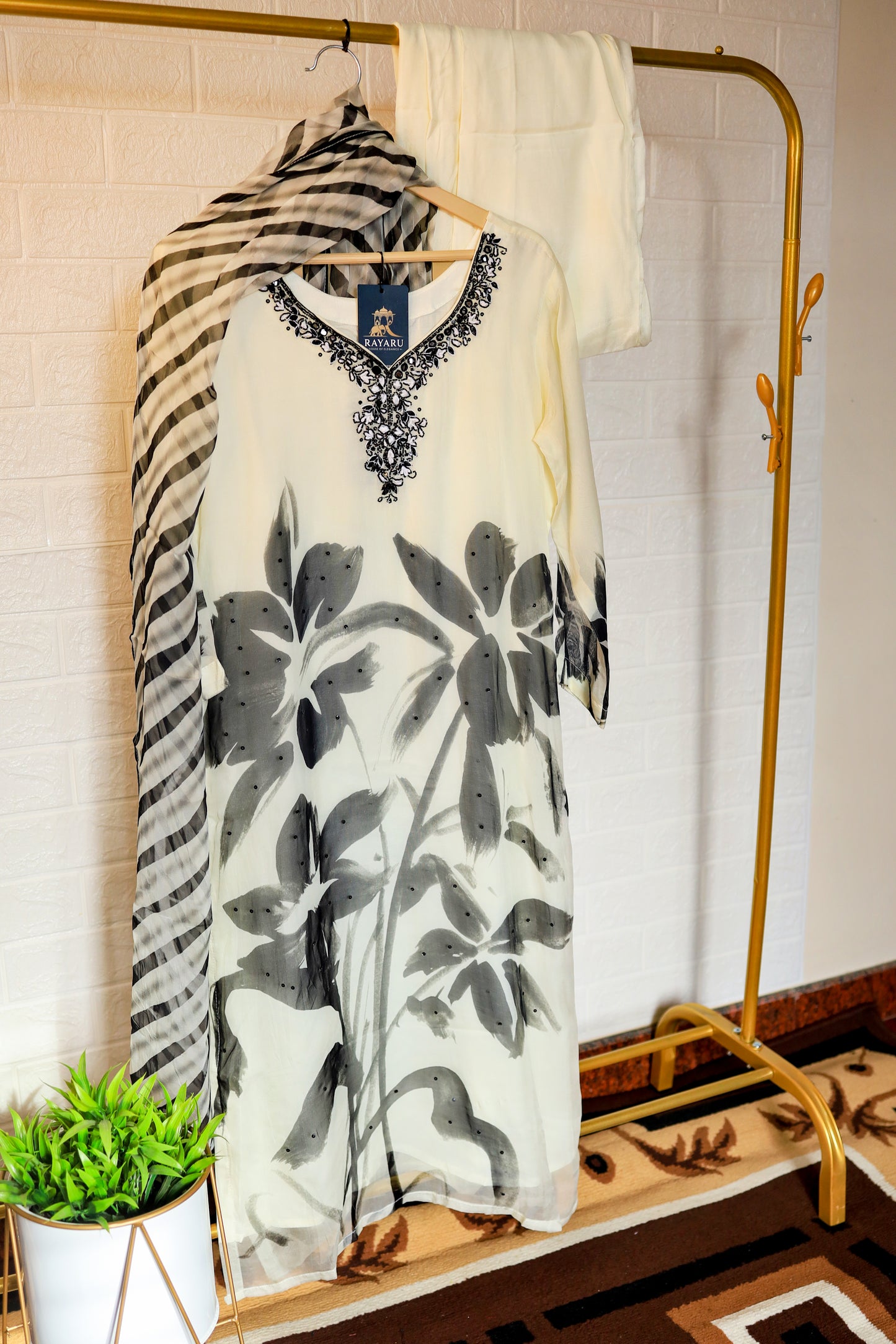 Elegant white organza kurta featuring intricate black embroidery