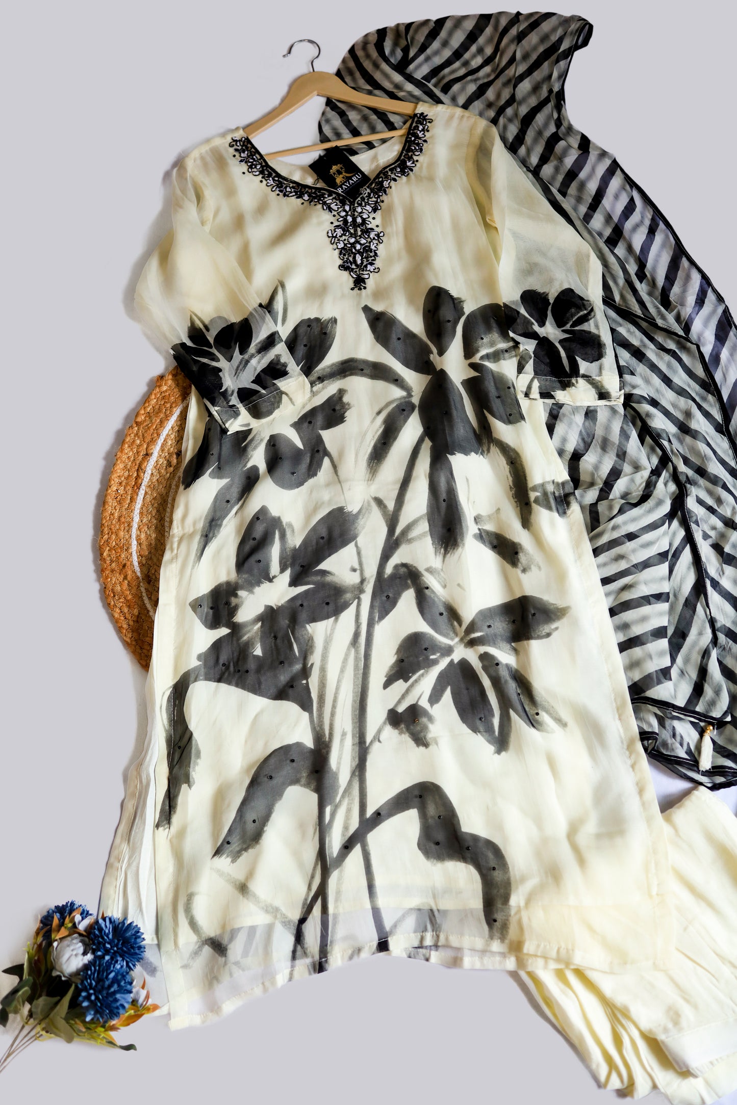 Elegant white organza kurta featuring intricate black embroidery