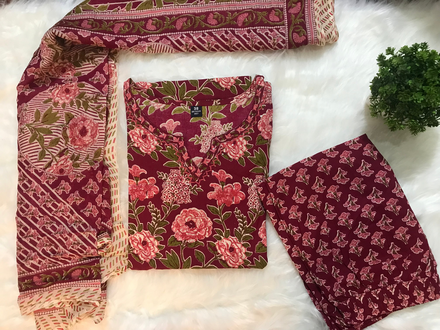 Set of patterned fabric pieces on a white background