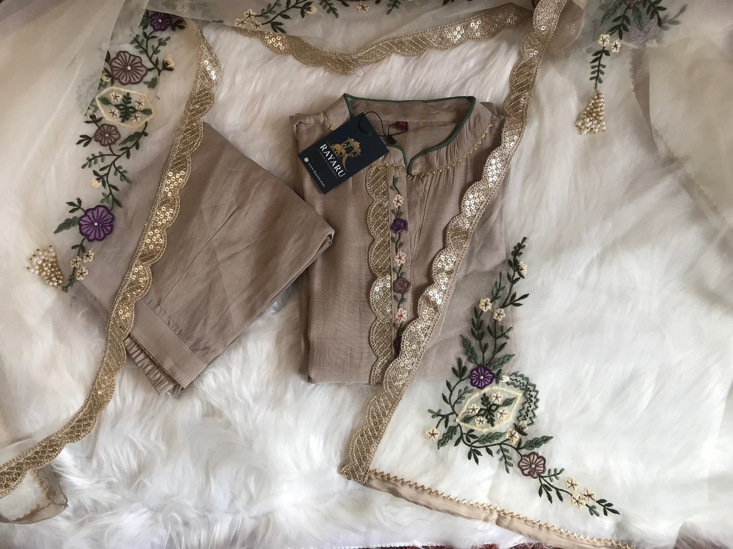 Elegant beige kurti paired with pant and a grand dupatta
