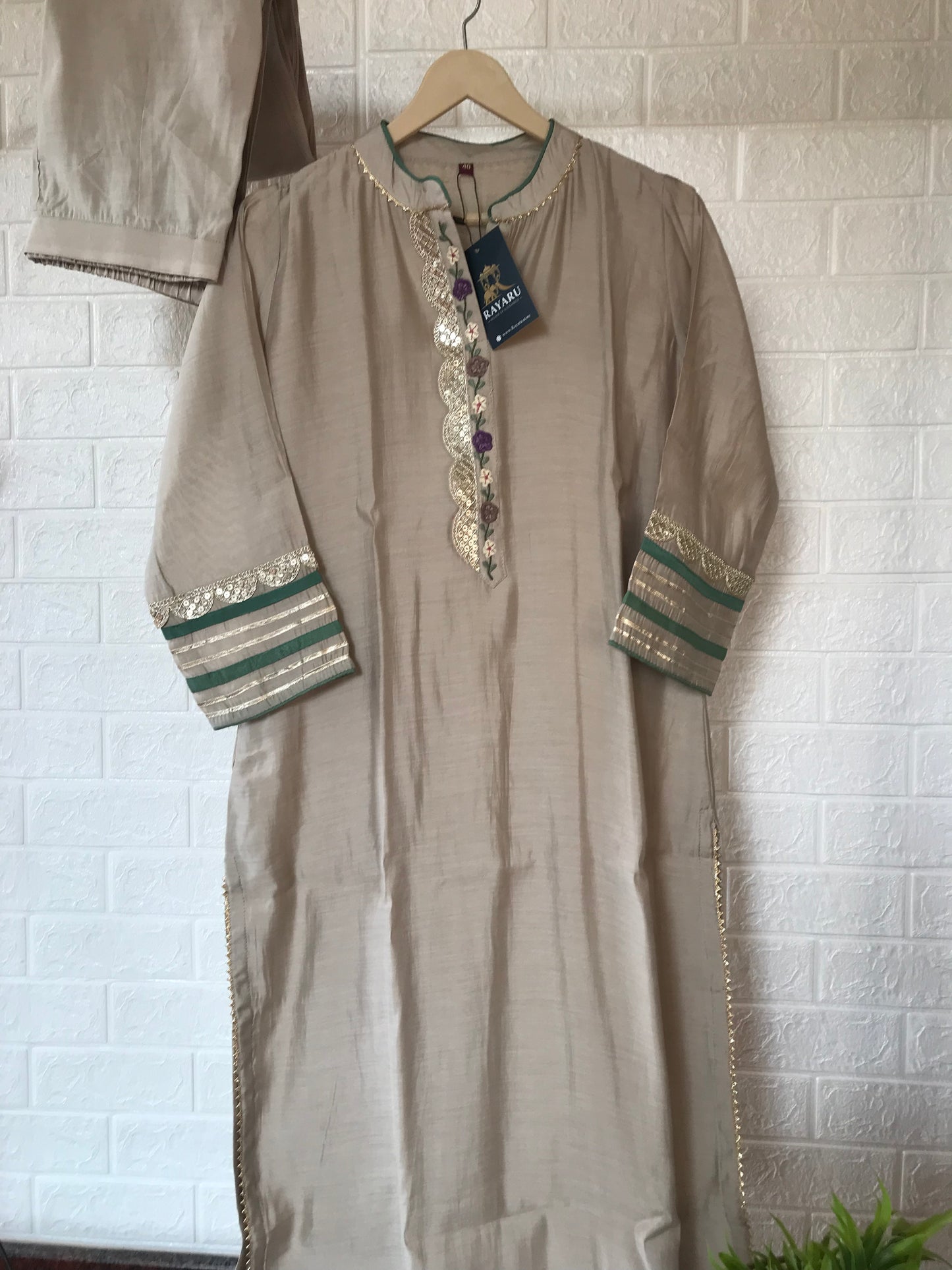 Elegant beige kurti paired with pant and a grand dupatta