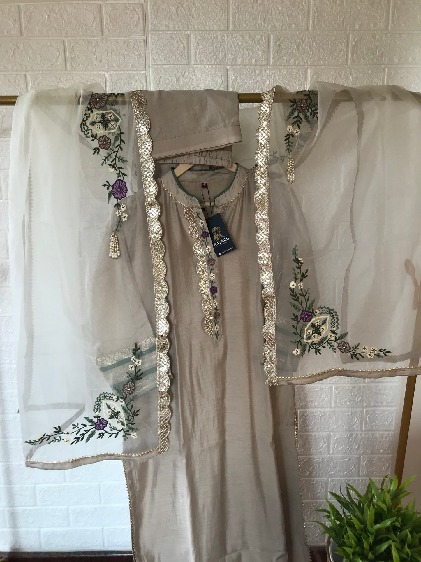 Elegant beige kurti paired with pant and a grand dupatta