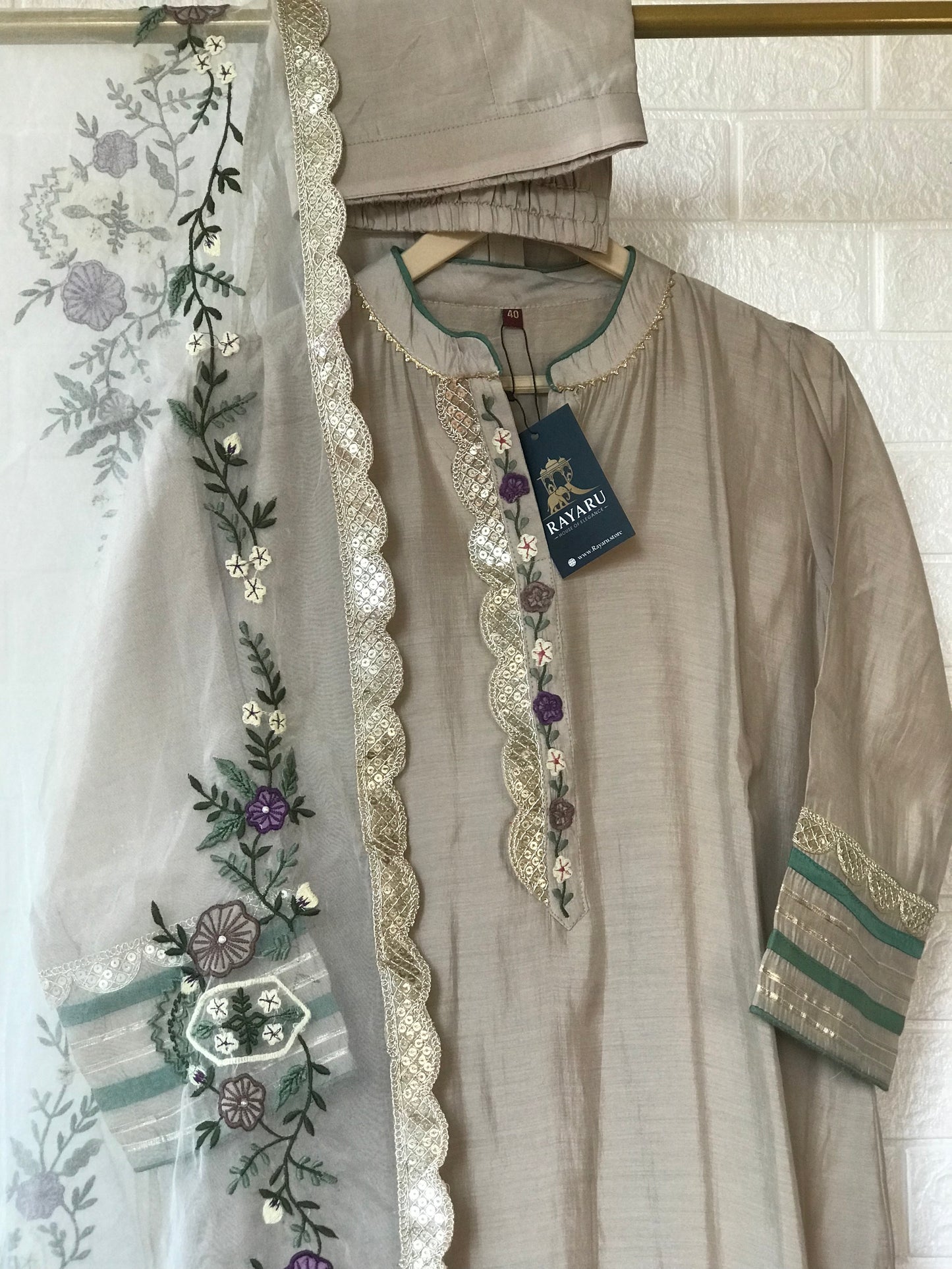 Elegant beige kurti paired with pant and a grand dupatta