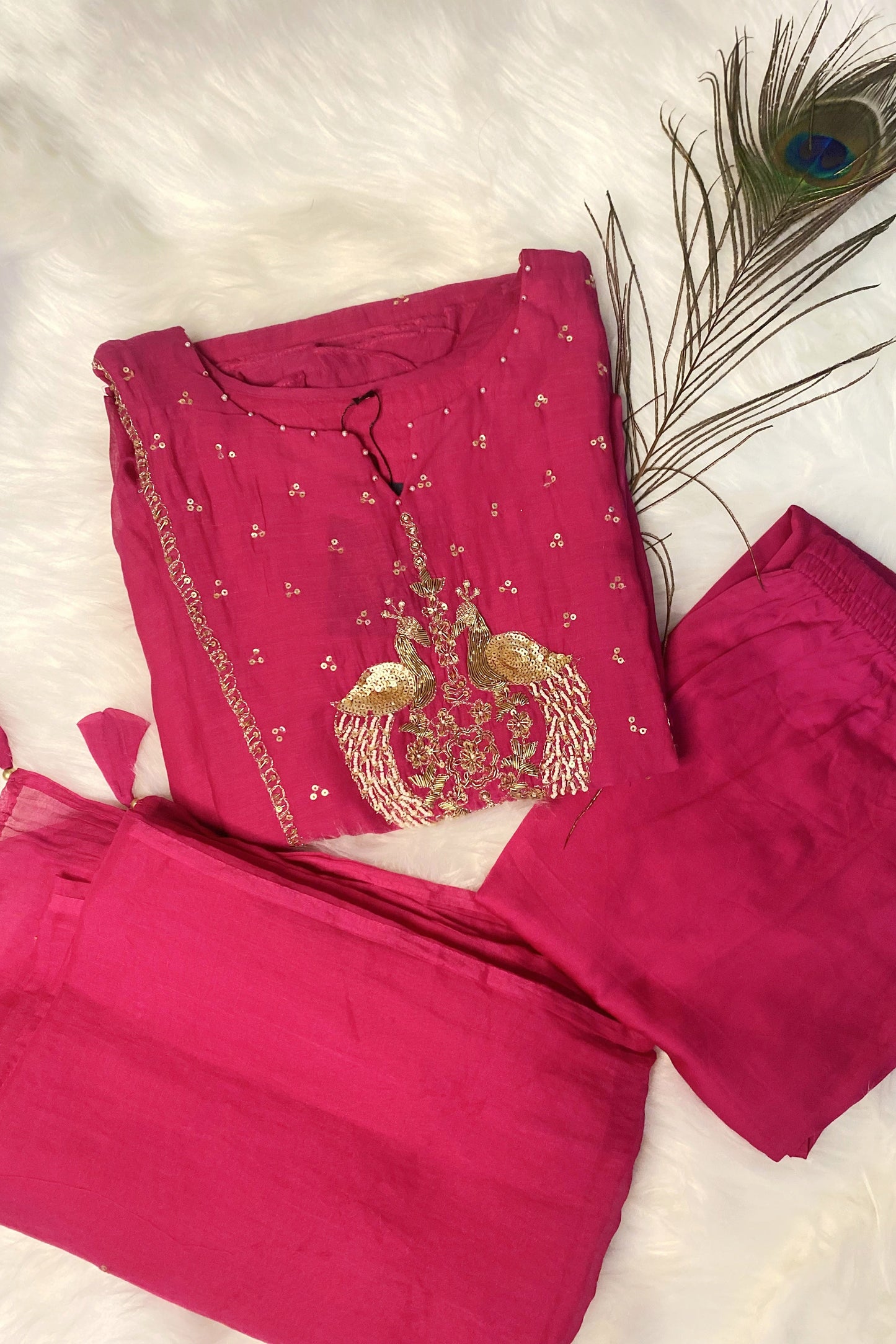 Elegant pink Mul Chanderi kurta with gold peacock embroidery.