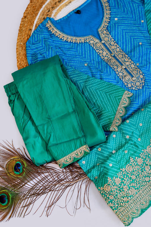 A stunning teal blue silk Kurti adorned with intricate golden threadwork