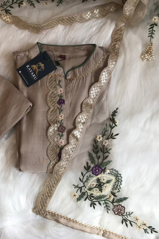 Elegant beige kurti paired with pant and a grand dupatta